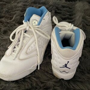 White leather Air Jordan basketball sneakers
